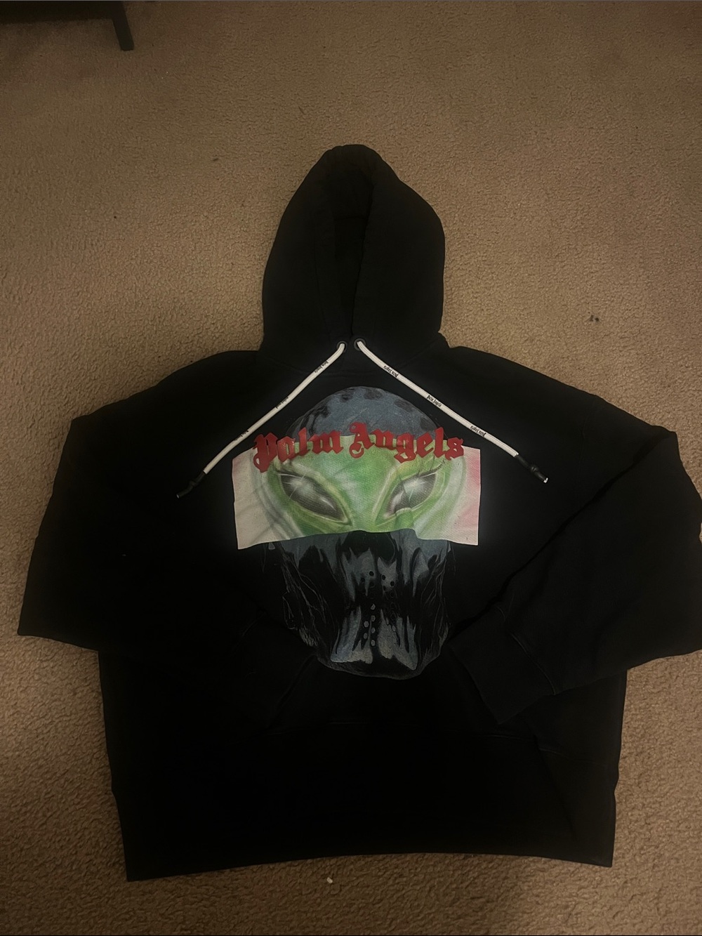 Palm Angels Black Hoodie with Green Alien Graphic and Red Logo
